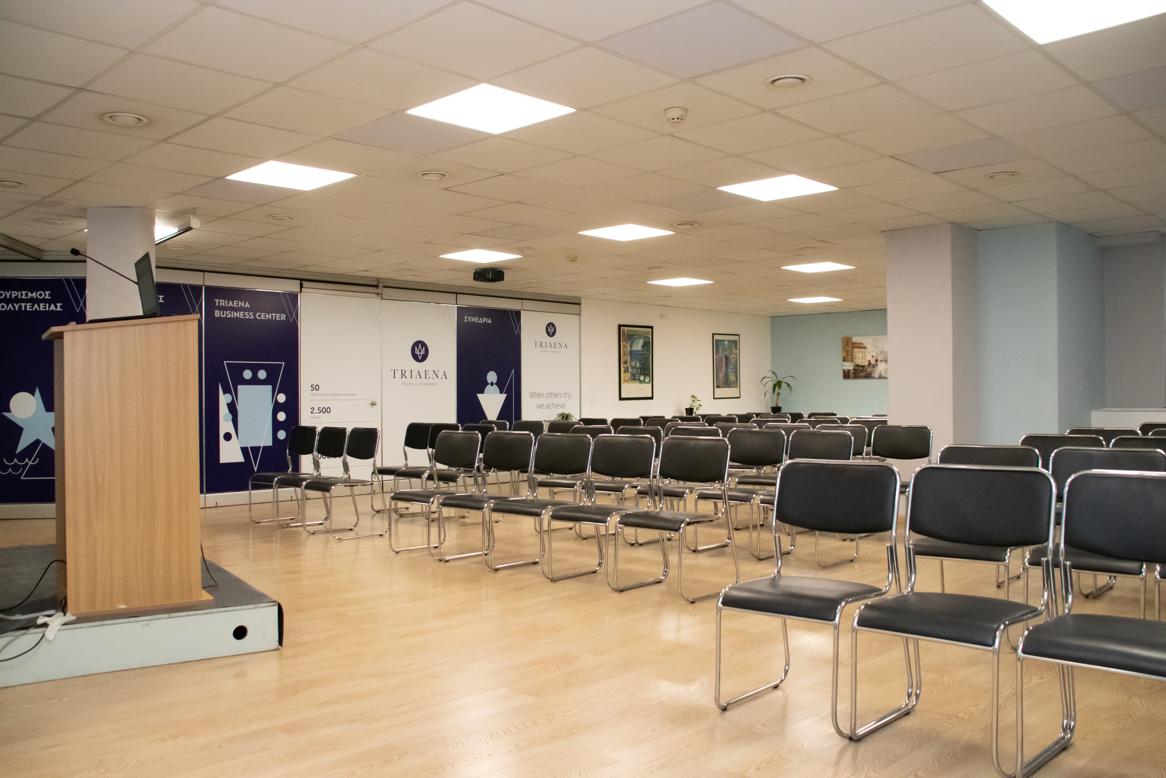 Big Conference Hall with a speaker’s podium and neatly arranged audience seating, prepared for a formal event